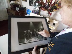 Silver Bullet Days: Robins checking out a photograph of himself on stage with the Silver Bullet Band. (Photo/Local Spins)