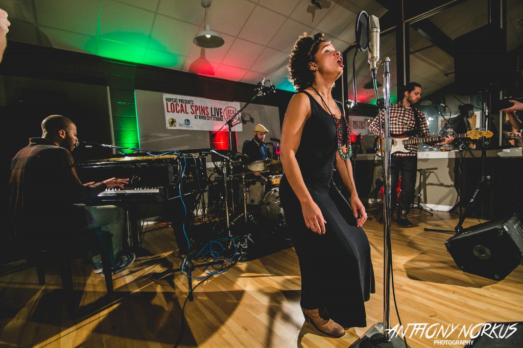 On the Move: Molly Bouwsma-Schultz of Vix Vidorra performing at River City Studios with Ryan K. Wilson, left, Theo Ndawillie II and Scott Schultz. (Photo/Anthony Norkus)