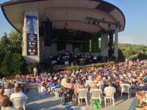 With a gentle breeze helping the cause, the sellout crowd didn't seem to mind the heat. 
