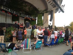 Causing a Stir: Robinson's grand entry got the crowd on its feet and the shutters snapping.  