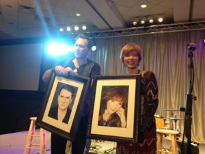 Peter Karp & Sue Foley were presented portraits of themselves by The Pinnacle Center's Bill Worst on Saturday. 