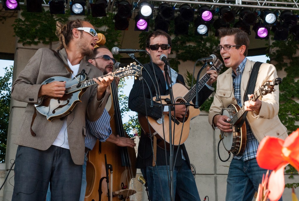 Benefit for a Bassist: Fauxgrass mandolinist Jason Wheeler, left, organized Friday's all-star lineup at Rockford Brewing to aid bassist Tim McKay, second from left. 