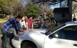 Hands on the Car: From left, Adam Balcer, Tim McKay, Jason Wheeler and Bill Kirchen goofing around in Texas. 