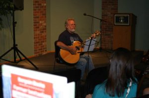 Joe Helpser performing at Schuler Books.