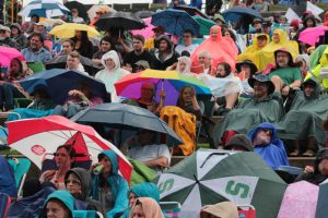 Umbrella Power: A few scattered rain showers had some folks covering up. (Photo/Anna Sink)