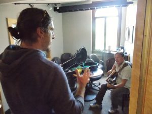 Murphy on Thursday helping coordinate an on-air appearance by singer-songwriter Ellis Paul.