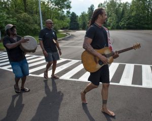 Pre-Show Serenade: Franti and band members strolling the parking lot. (Photo/Chris Clark)
