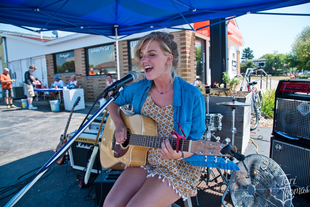 Singing the Song, Walking the Beat: Loren Johnson was one of 60 acts playing temporary stages across Grand Haven on Saturday. (Photo/Tori Thomas)