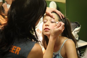 Glitter and glam: The girls get ready backstage before the big show. (Photo/Taylor Mansen)