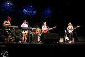 Rocking "Tops": The Onomatopeias performing on stage at The Wealthy Theatre. 