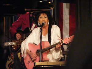 Glamorous and Relevant: Jackson on guitar.