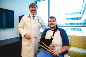 Dr. Drums x 2: Dr. Stephen Bloom, drummer for Mid-Life Crisis, with Tkaczyk at Mary Free Bed. (Photo/Anthony Norkus, Courtesy of Mary Free Bed)