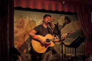 Pink Pony Gig: Musician Brian Thomas performing in the Pink Pony on Mackinac Island. (Photo/Sam Staffan)