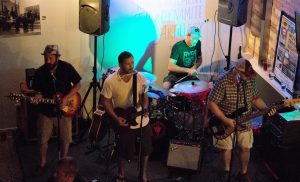 Playing Grand Armory Brewing: The band performing in Grand Haven earlier this year. (Photo/Loren Johnson)